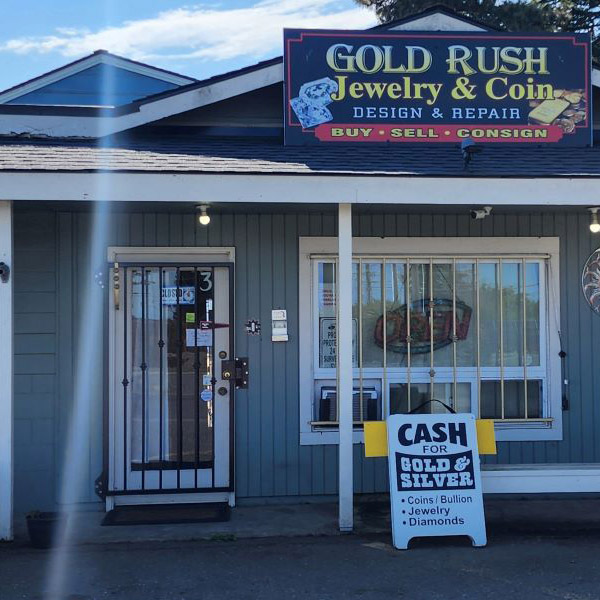 A large logo depicting the news story SEQUIM GOLD STORE OWNER ARRESTED FOR BILKING CUSTOMERS