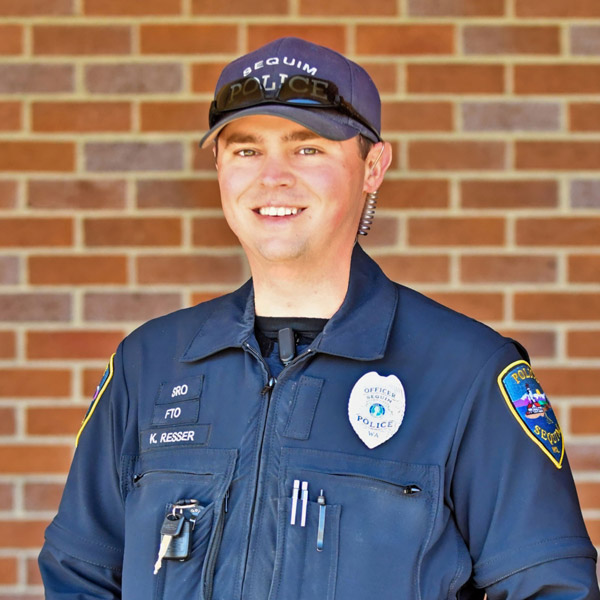 A large logo depicting the news story SEQUIM POLICE OFFICER KYLE RESSER PROMOTED TO PATROL SERGEANT